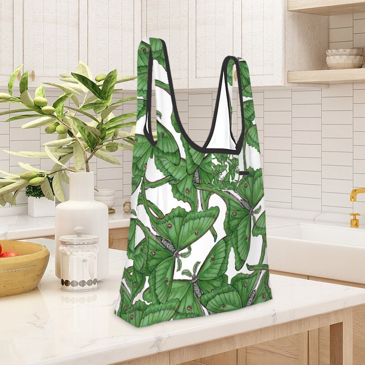 Folding shopping bag with green luna moth pattern